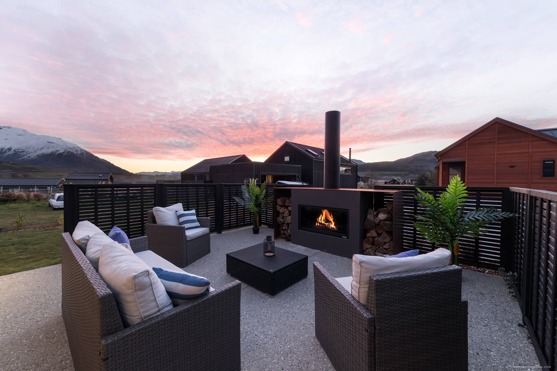 adding an outdoor fireplace to an outdoor entertaining area