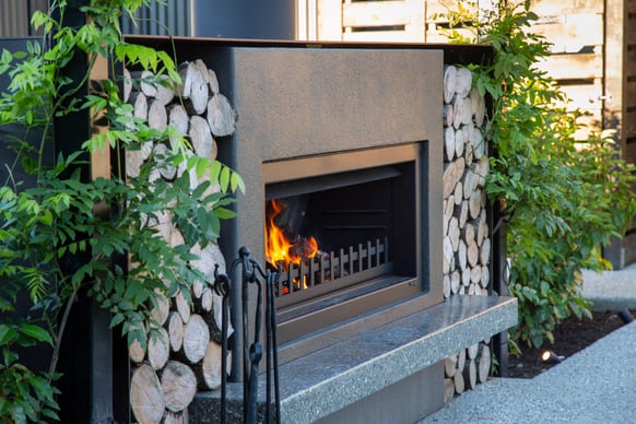 outdoor entertaining area with an outdoor fireplace in Queenstown