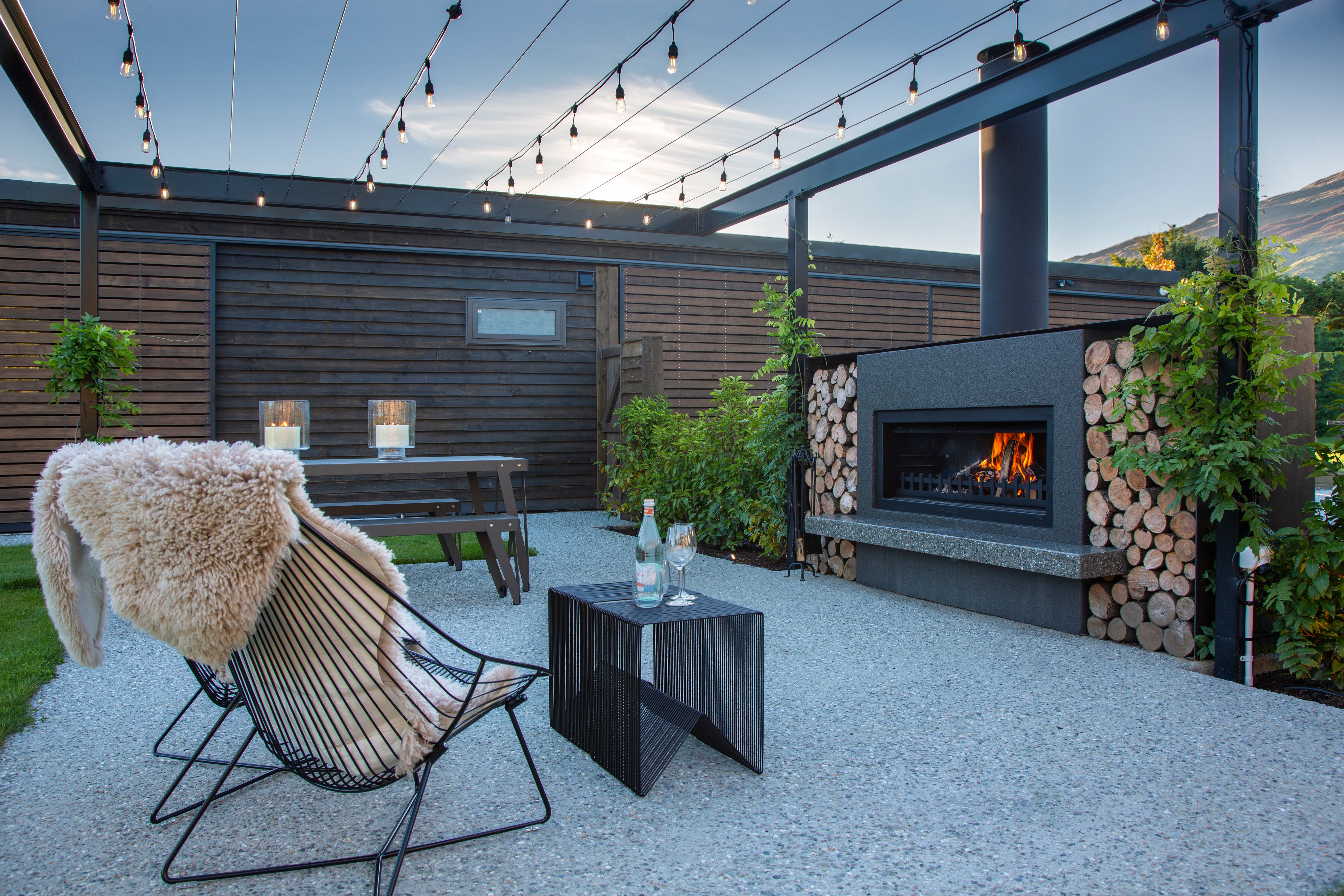 Adding a range of accessories to your fireplace such as a a polished concrete hearth or woodboxes will dramatically add style to your outdoor fire 