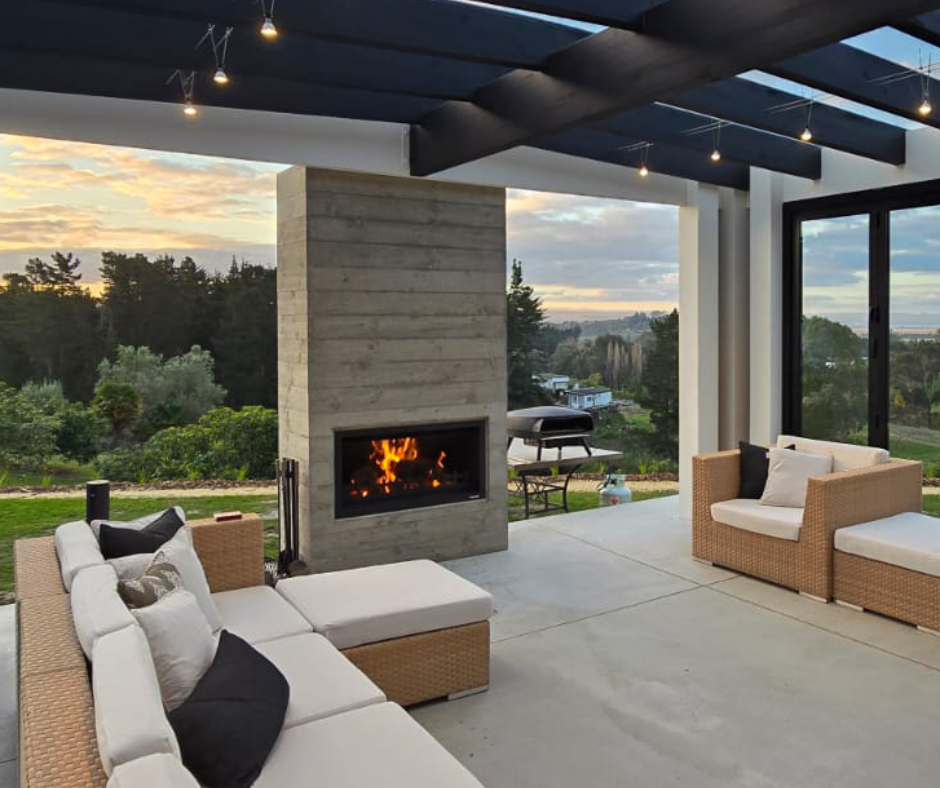 Hudson outdoor fireplace installed next to a louvre roof system