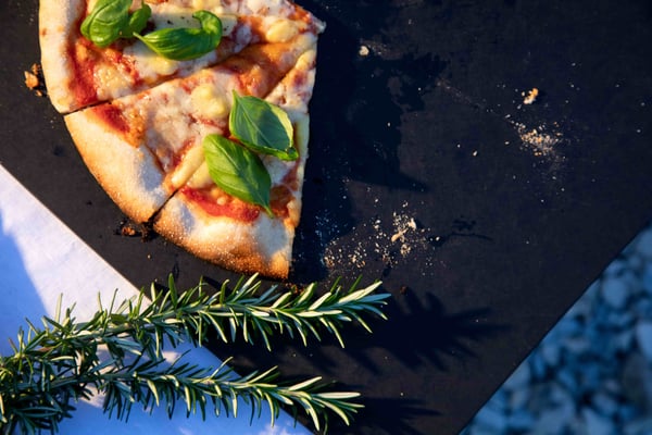 Cooking pizza on outdoor fireplace