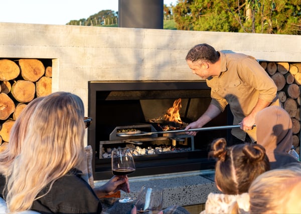 Cooking on an outdoor fireplace | Pizza hood insert