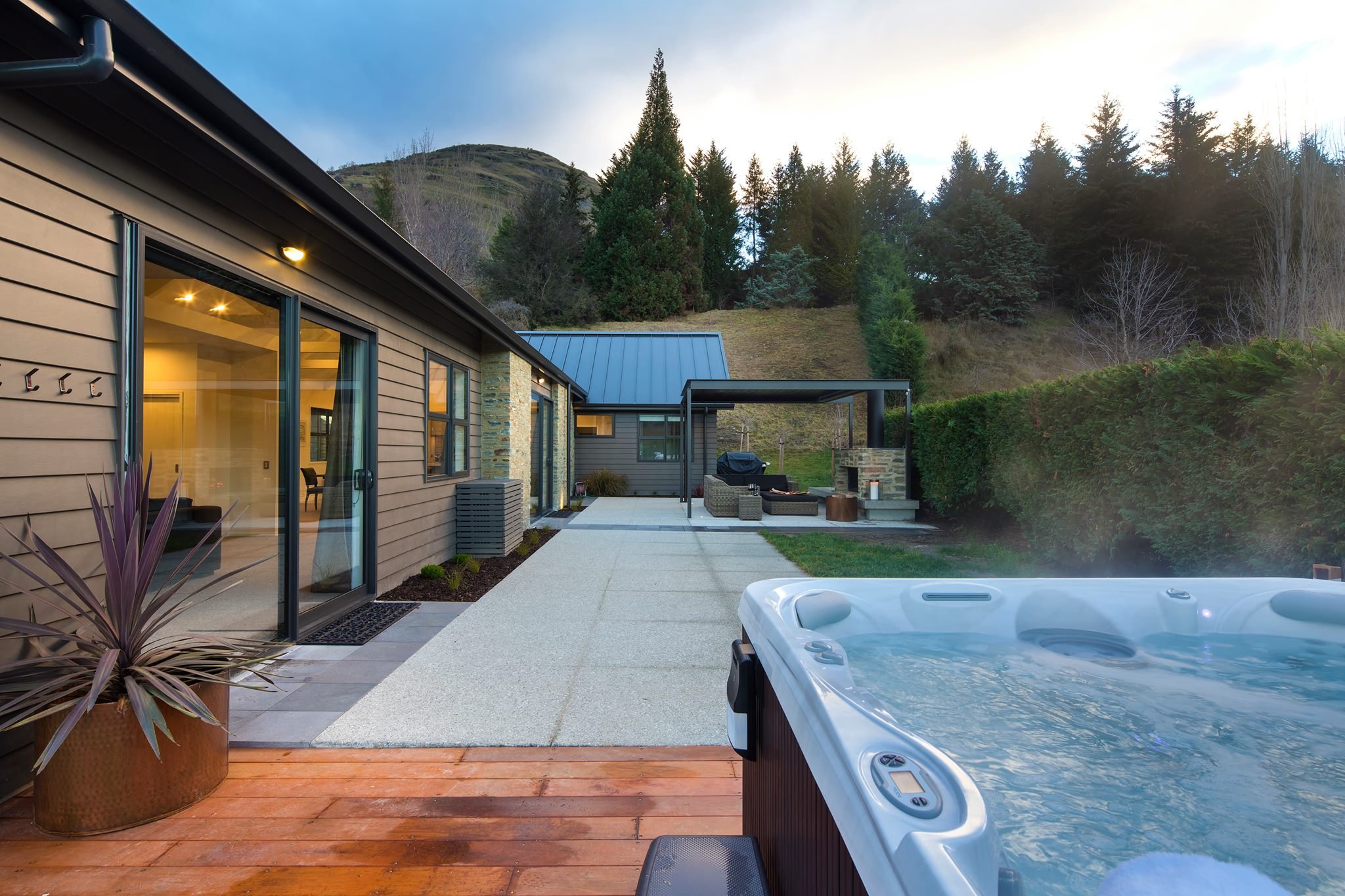 Burton outdoor fireplace with spa pool entertaining area