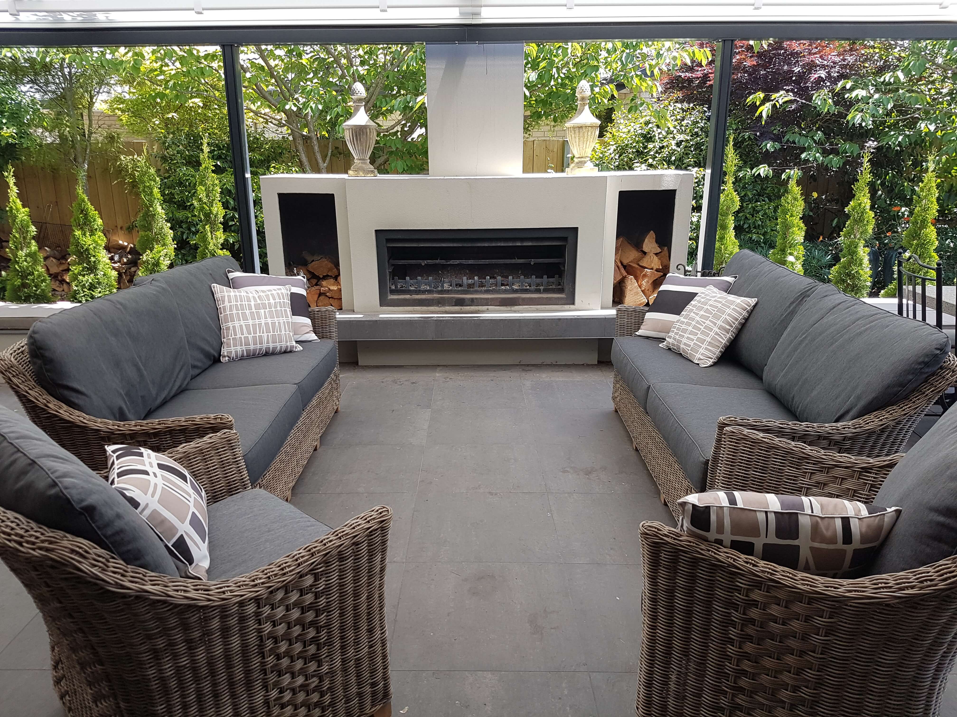 burton outdoor fireplace with couches in an entertainment outdoor