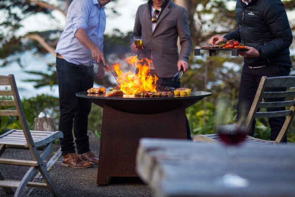 Outdoor cooking fire pits
