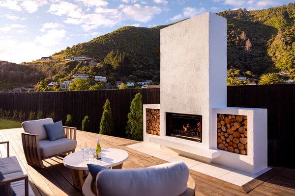 Hudson outdoor fireplace with tiled hearth on a deck