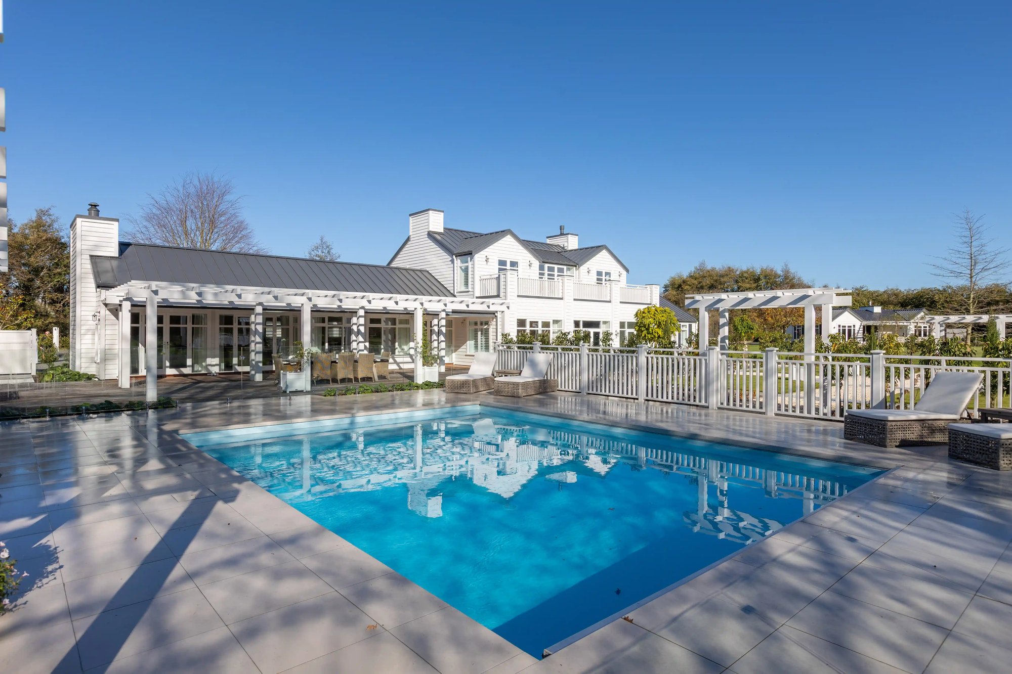 'House of the year' featuring an outdoor fireplace