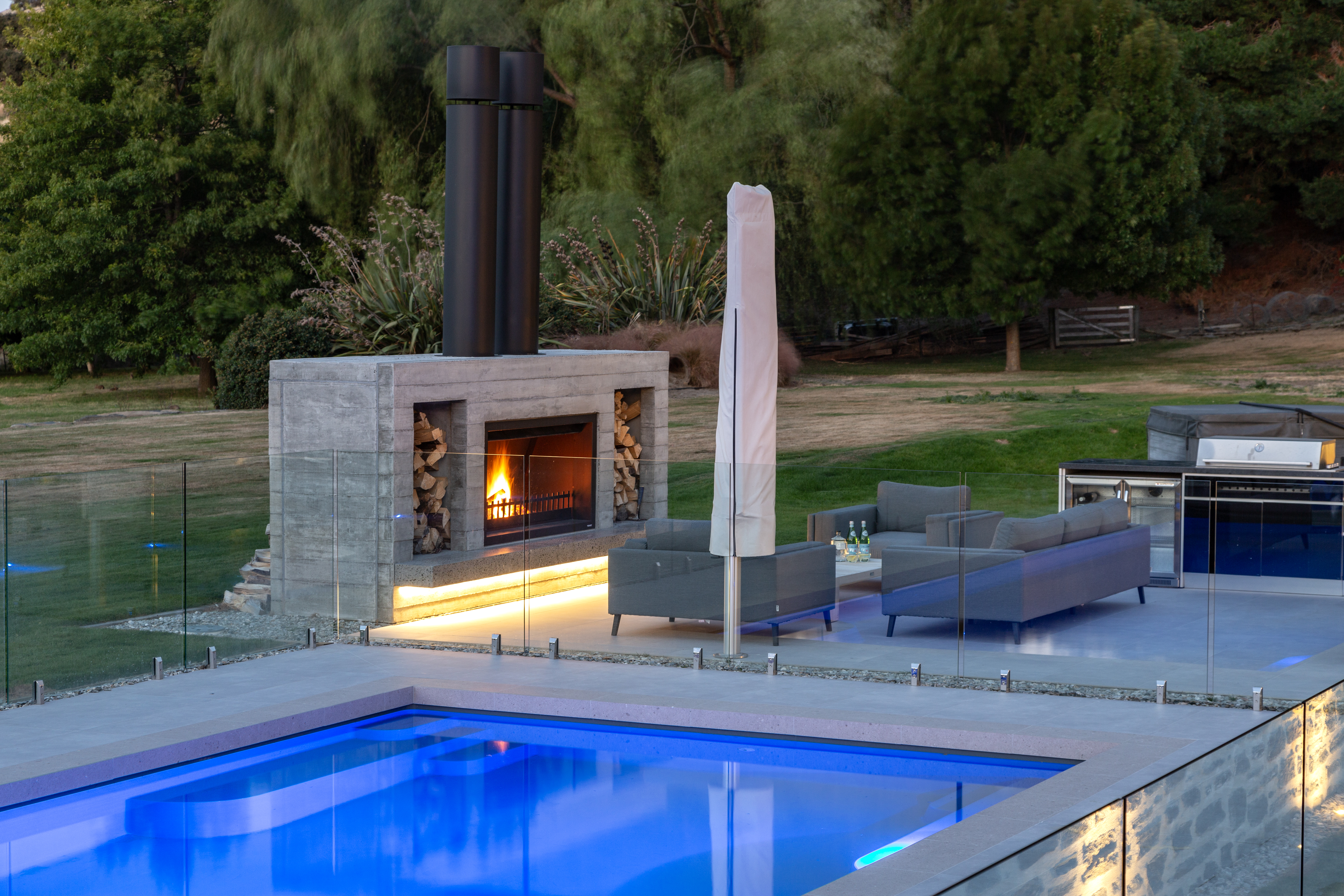 Twin outdoor large fireplace design