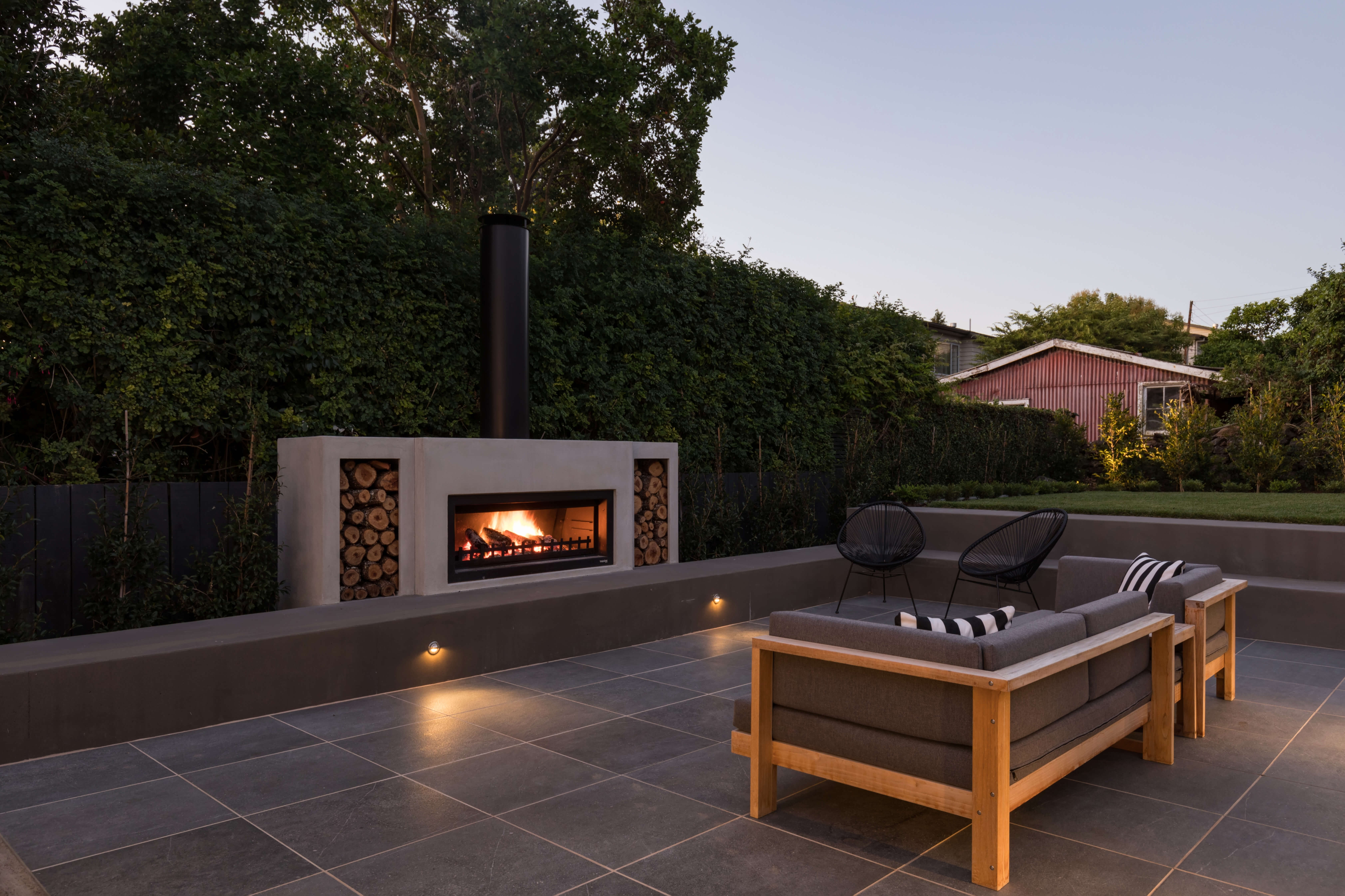 Outdoor fireplace with chimney cap