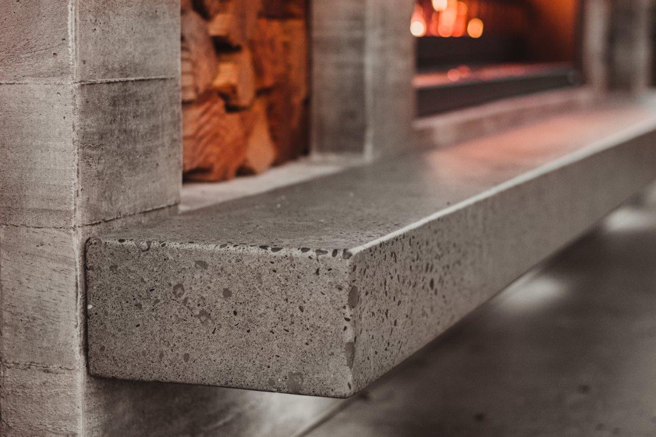 Polished concrete hearth for fireplace