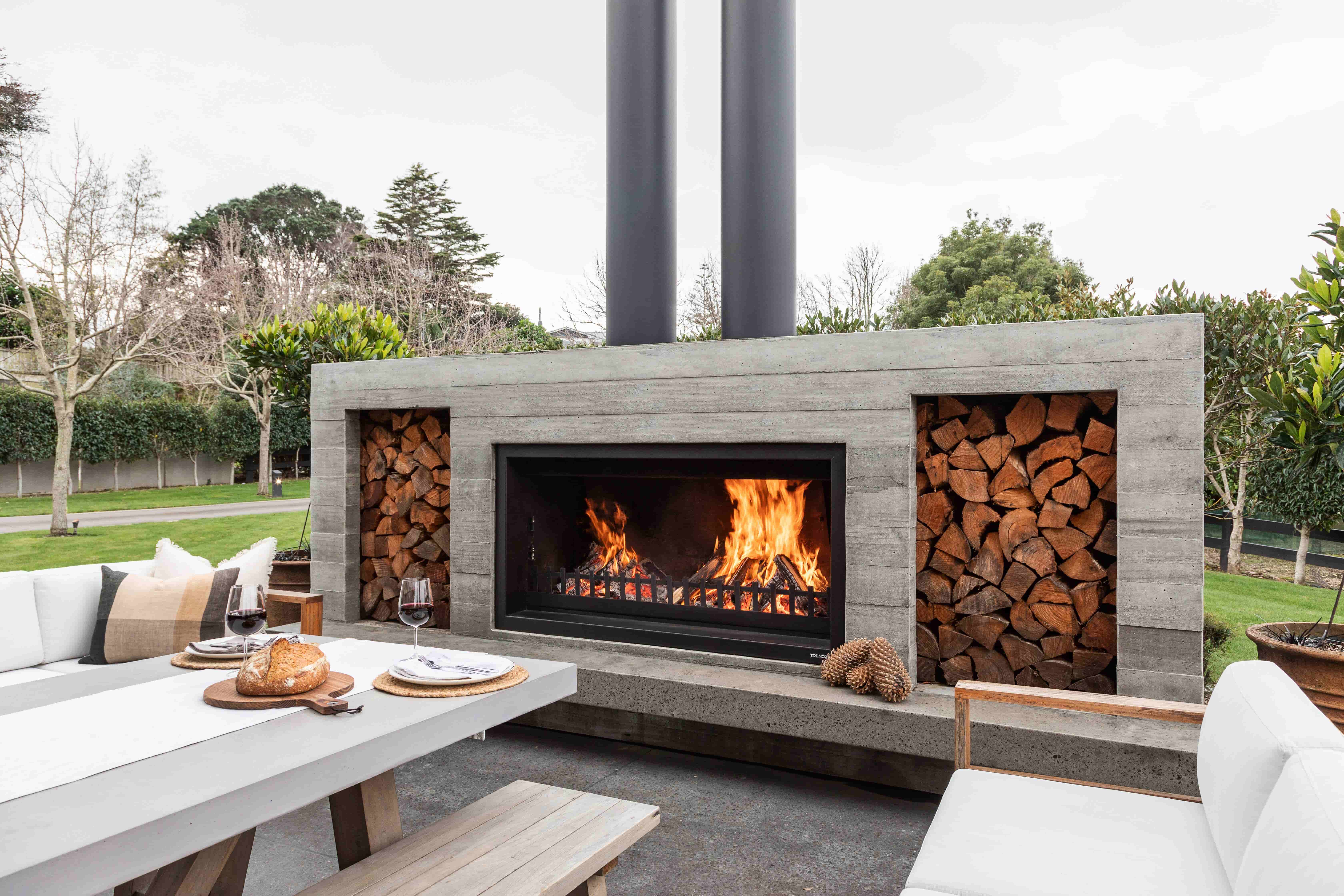 Fireplace | Bare wood-grain concrete finish | Wood boxes | Hearth