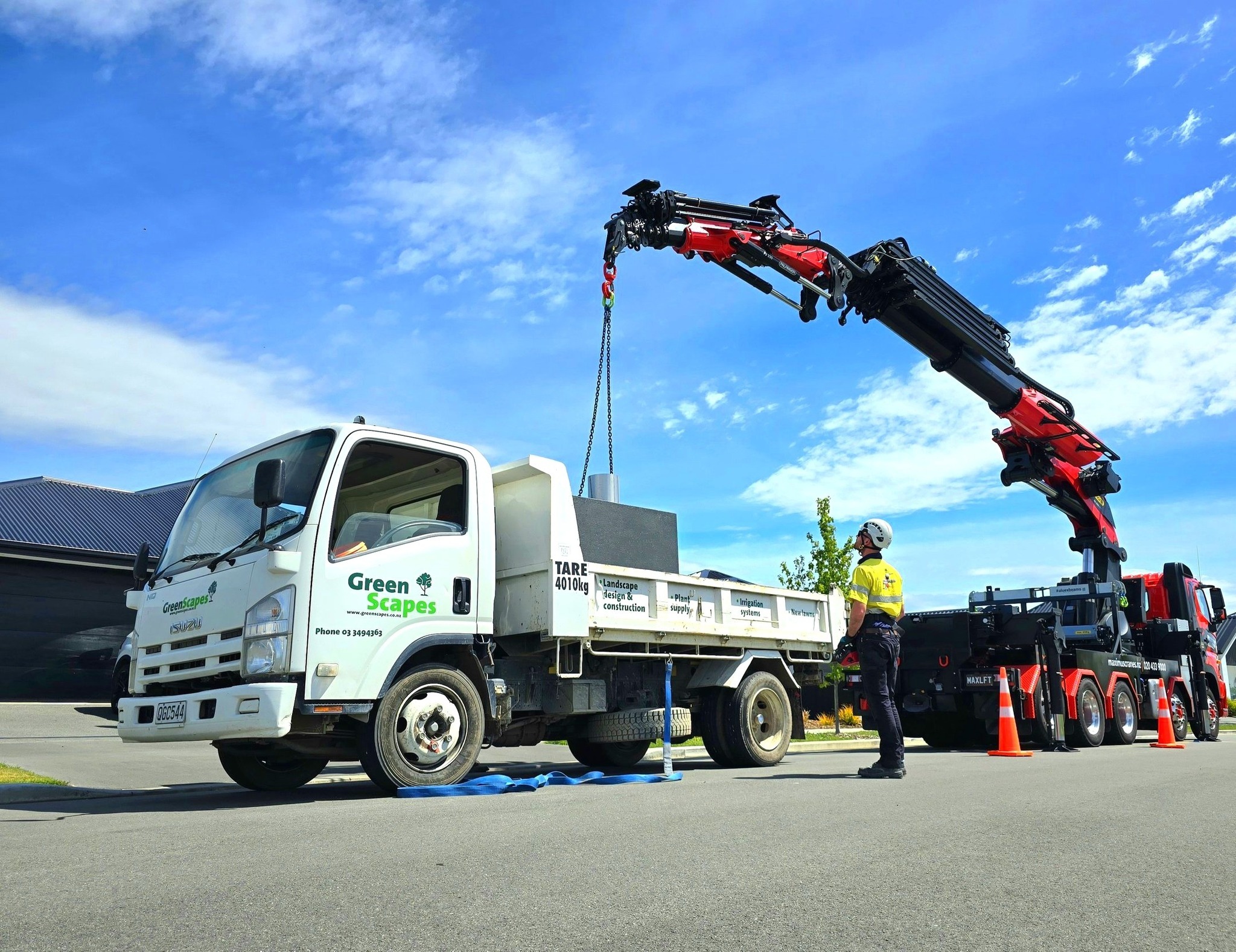 outdoor fireplace being craned into backyard